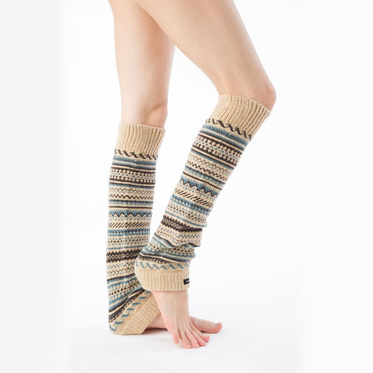 Side view of a woman's lower body wearing Knitido plus brand Wool Blend Fair Isle Leg Warmer in TAN color