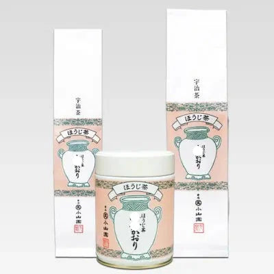 Ceramic tea canister with decorative packaging on a light gray background