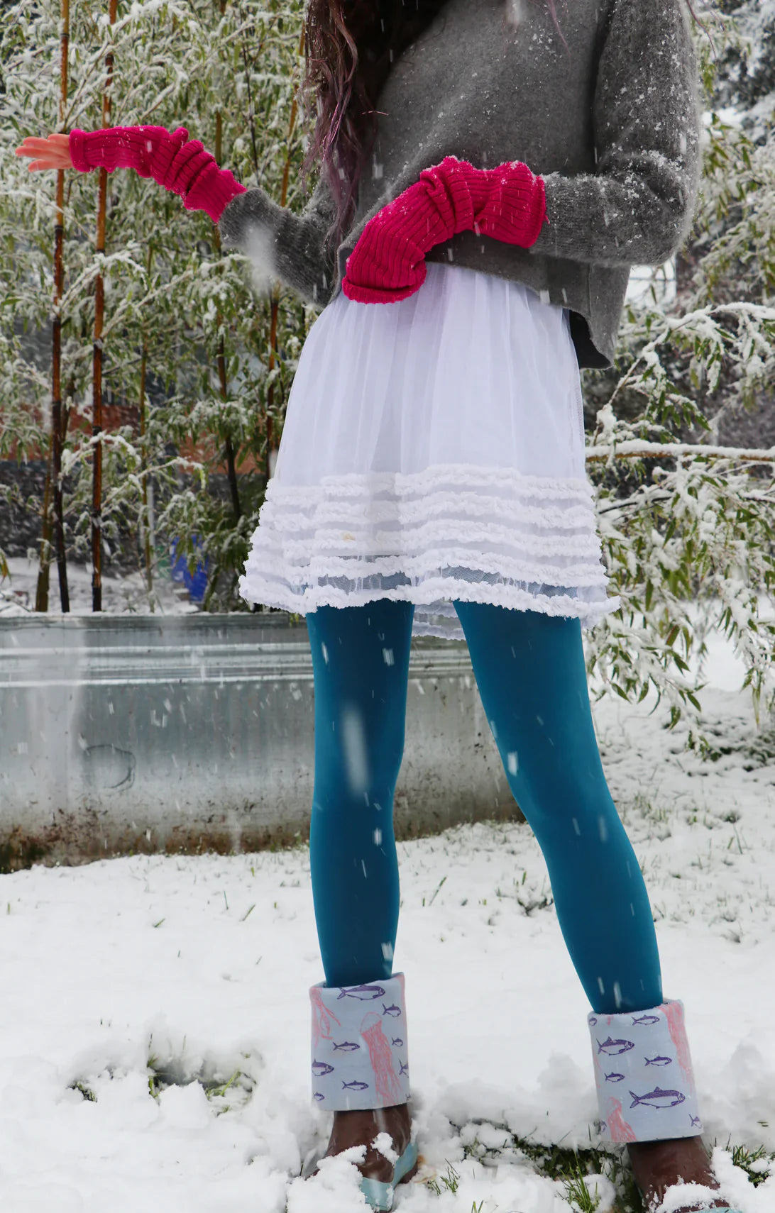 Woman in s white skirt wearing pink Wool Blend Ribbed Arm Warmer by Tabbisocks