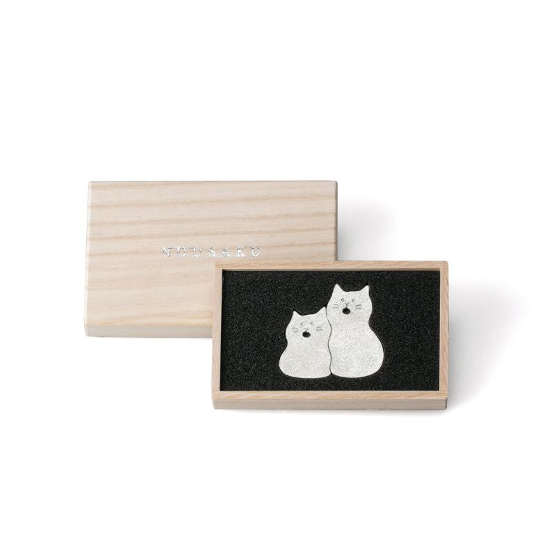 Wooden box with black interior featuring two white cat illustrations on a white background