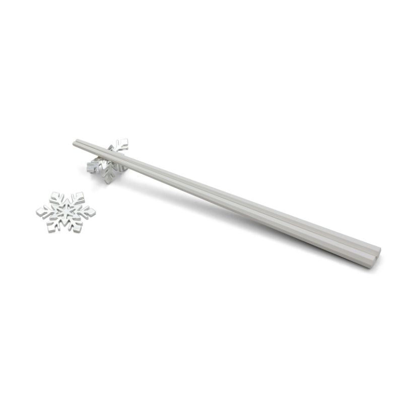 Silver snowflake earring and matching rod on a white background