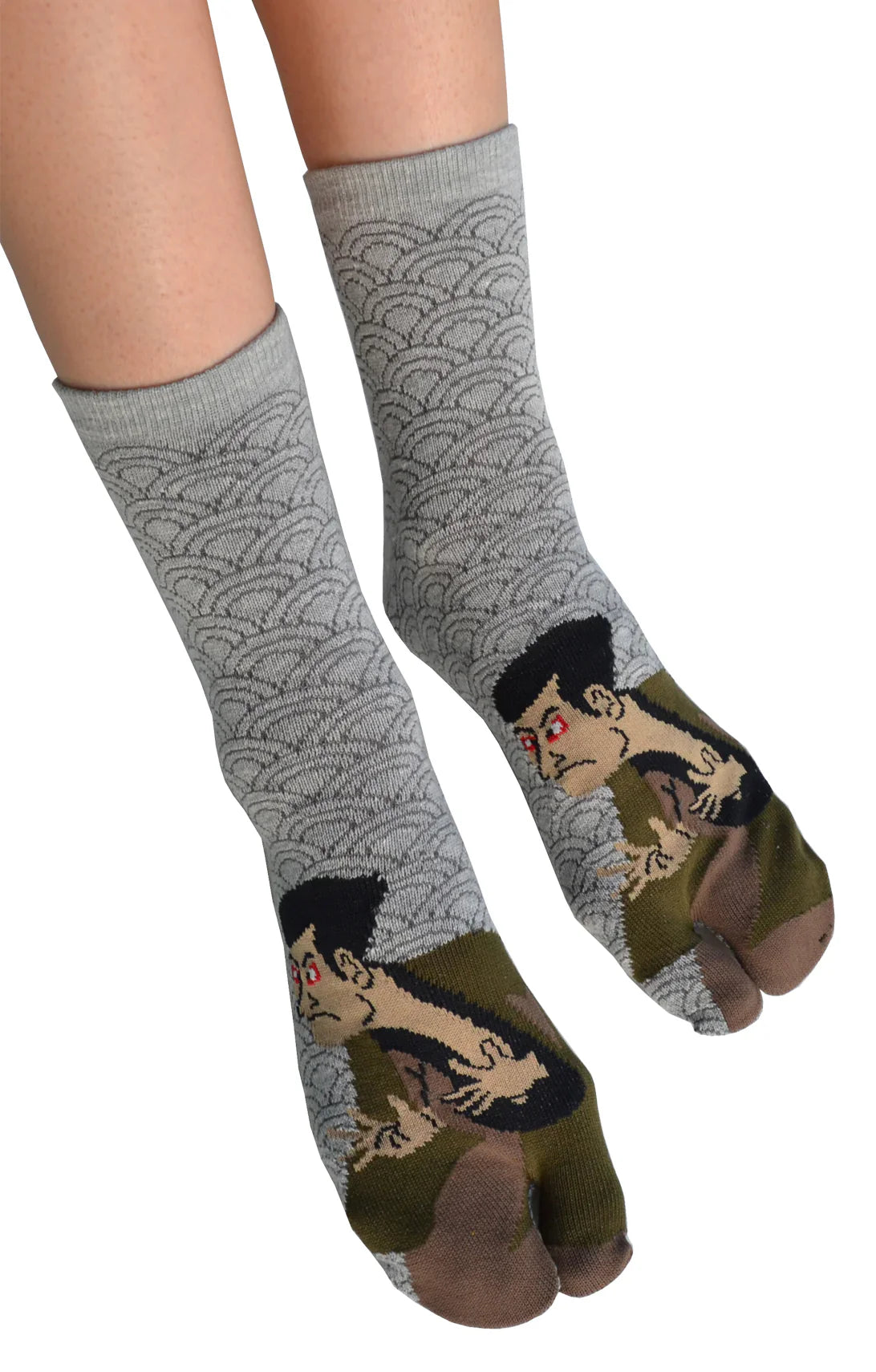 A woman is wearing KABUKI TABI TOE SOCKS Grey, a product name inspired by Japanese Kabuki by NINJA SOCKS