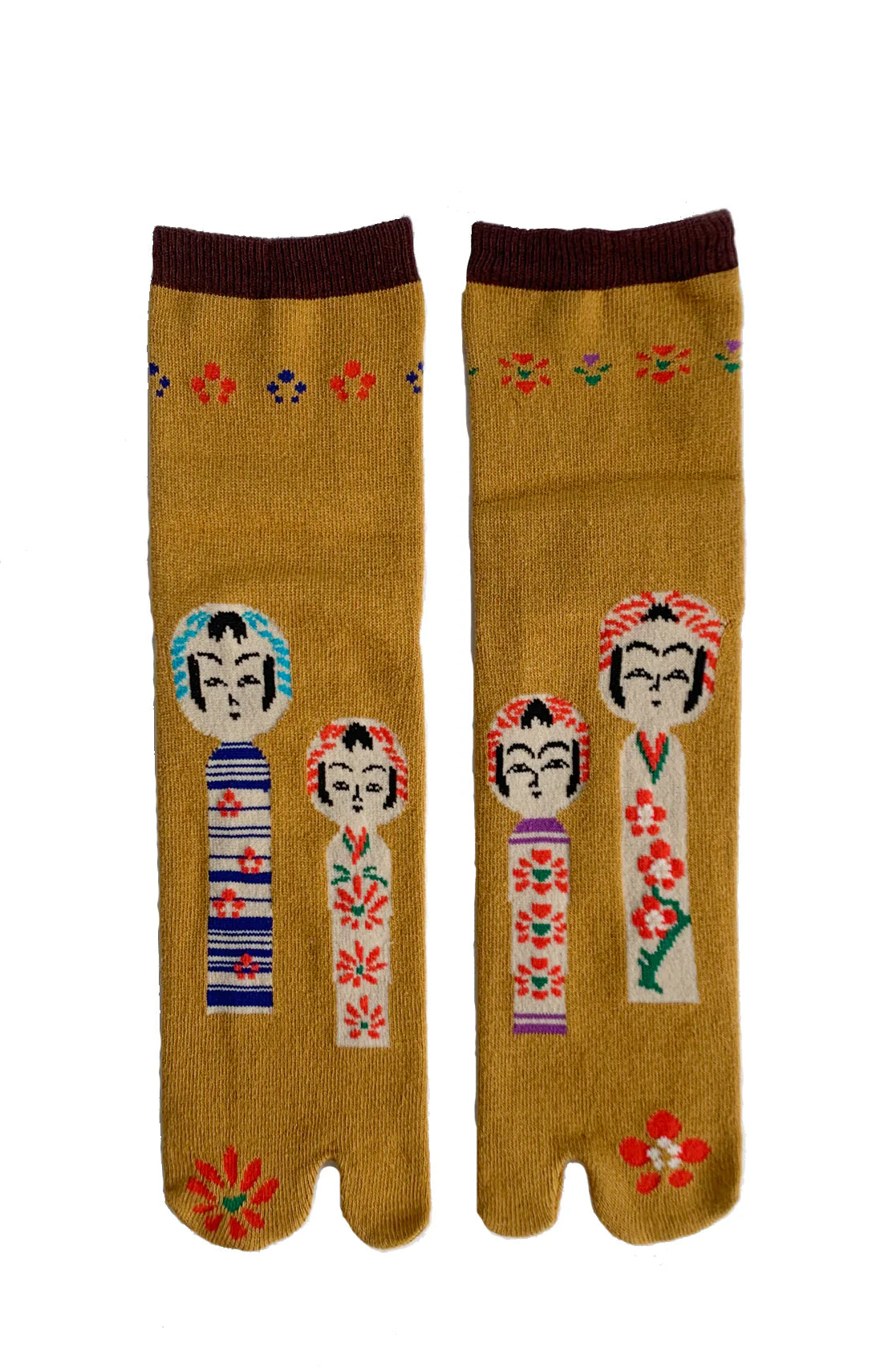 The pattern is a Japanese Kokeshi doll in the Mustard color of NINJA SOCKS' Kokeshi Doll Tabi Toe Socks