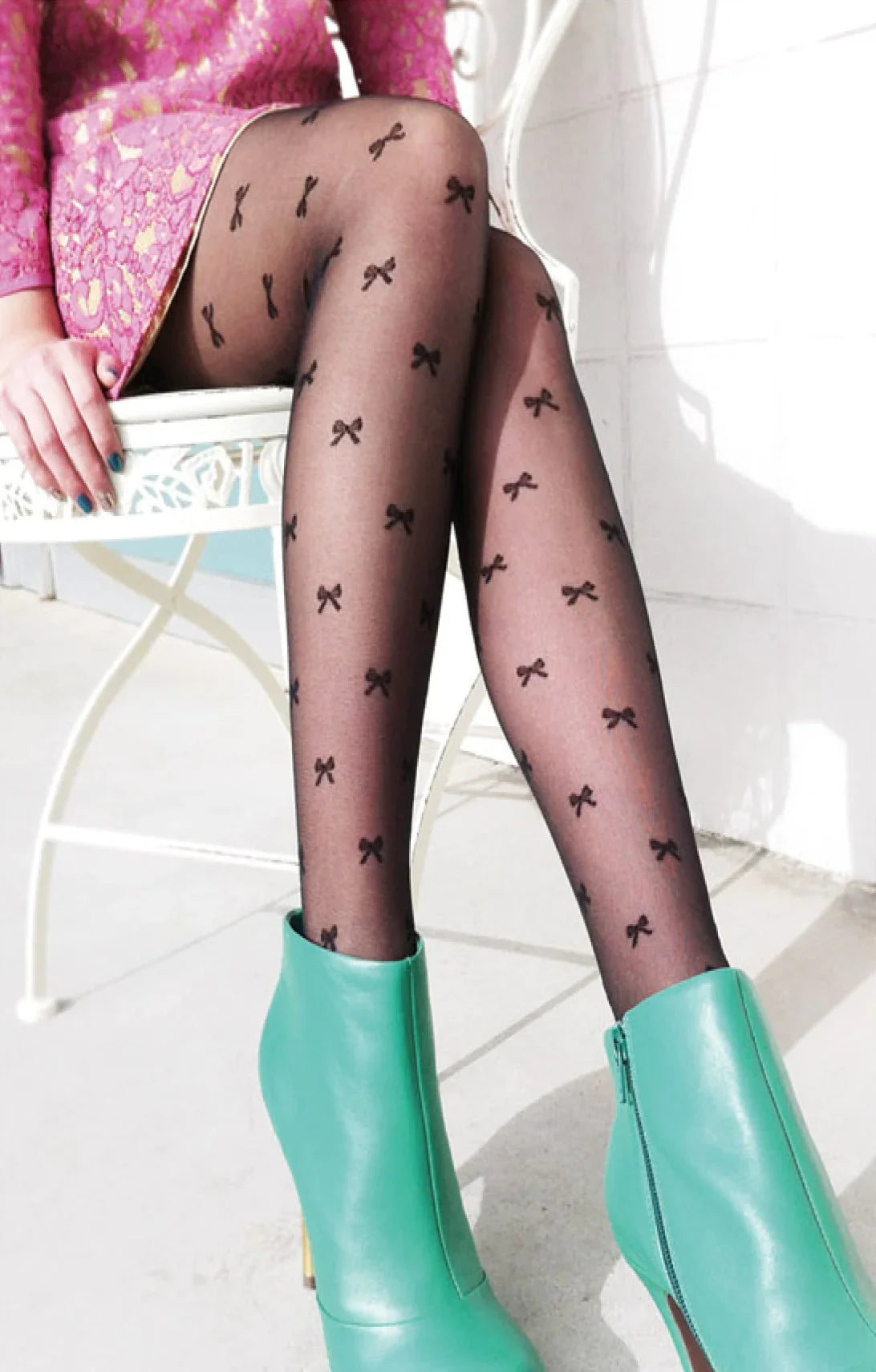 A photo of a woman's leg wearing Tabbisocks' trade name Ribbon Sheer Tights.