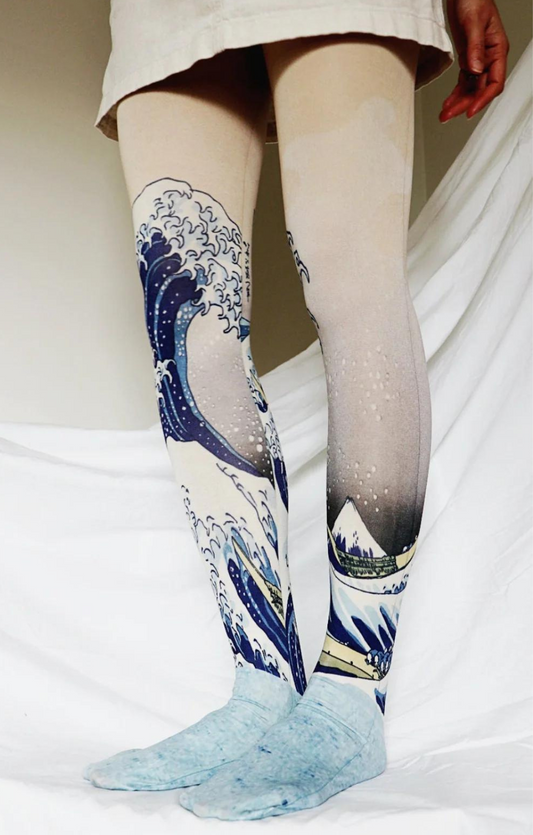 Tabbisocks' The Great Wave off Kanagawa by Katsushika Hokusai Printed Art Tights showing woman in ivory skirt wearing tights, leg at 45 degree angle