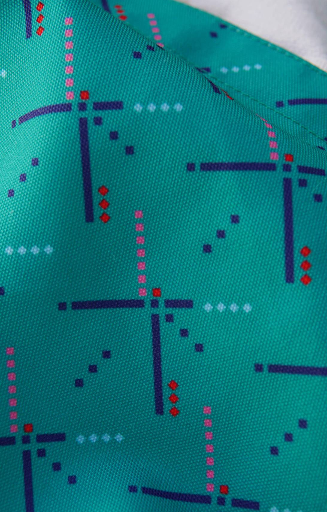 Teal fabric with geometric pattern